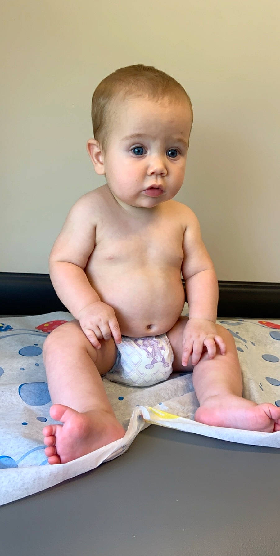 Gannon joined the competition — help win amazing prizes! baby, cheek, child, diaper, finger, leg, person, sitting, skin, toddler, tummy_time