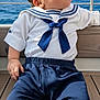 Cooper joined the competition — help win amazing prizes! baby, child, sailor_outfit, blue_pants, white_shirt, ocean, sea, deck, wooden_floor, railing, outdoor, sky, curious, looking_up, cute, infant, portrait, casual, sunlight, nautical