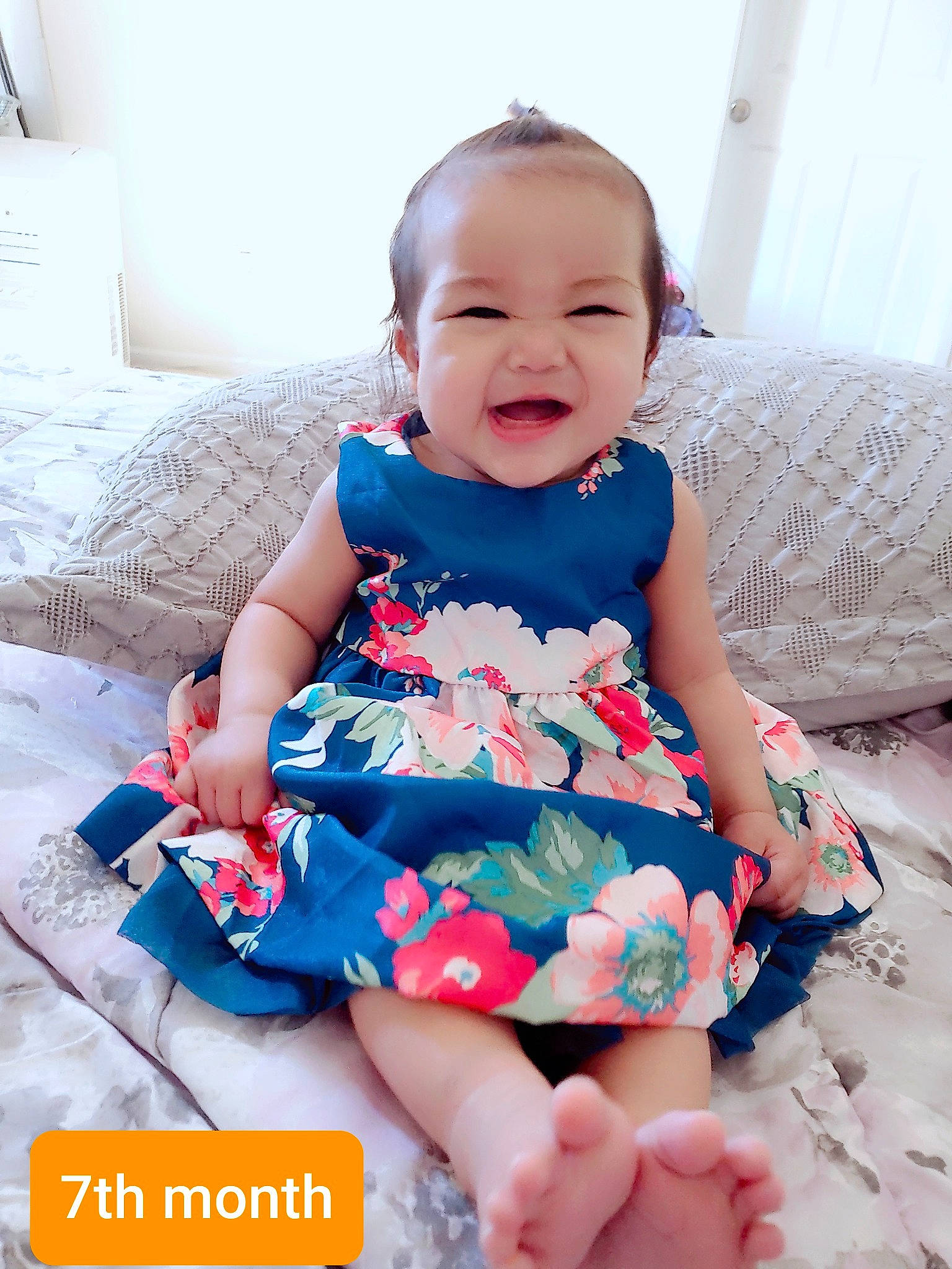 Arya is registered to the contest to win money with this photo: baby, baby_products, baby_toddler_clothing, child, clothing, design, dress, pattern, person, pink, play, product, sitting, sleeve, smile, textile, toddler