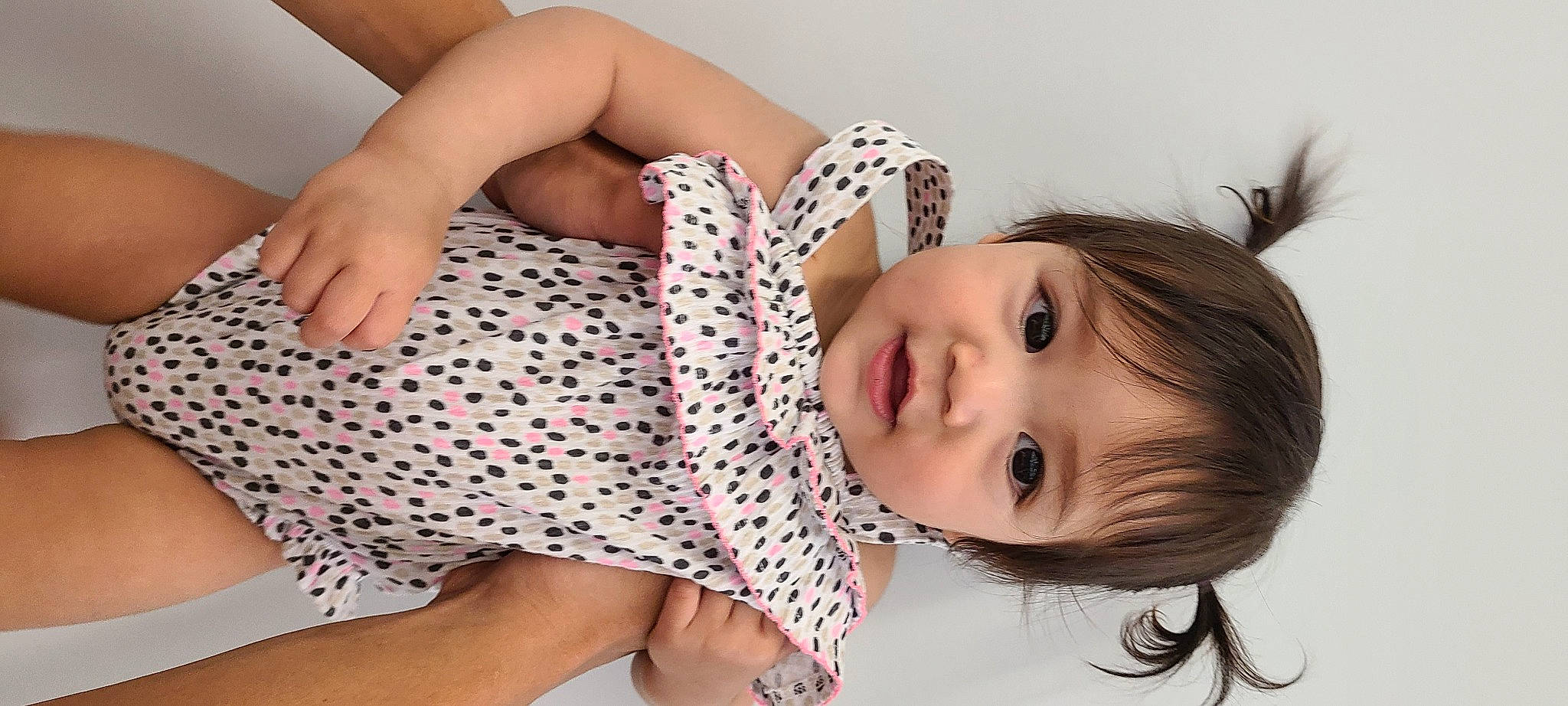 Arya is registered to the contest to win money with this photo: baby, beauty, black_hair, brown_hair, child, design, finger, human_leg, leg, long_hair, mouth, muscle, neck, pattern, person, polka_dot, sitting, skin, thigh, toddler