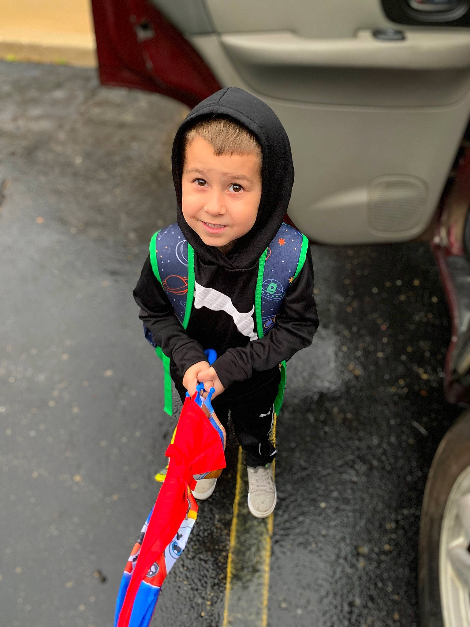 Lucas joined the competition — help win amazing prizes! asphalt, auto_part, automotive_exterior, automotive_lighting, automotive_tire, eye, fender, flooring, gas, happy, headwear, joy, motor_vehicle, person, road_surface, sidewalk, smile, tire, toddler, trunk