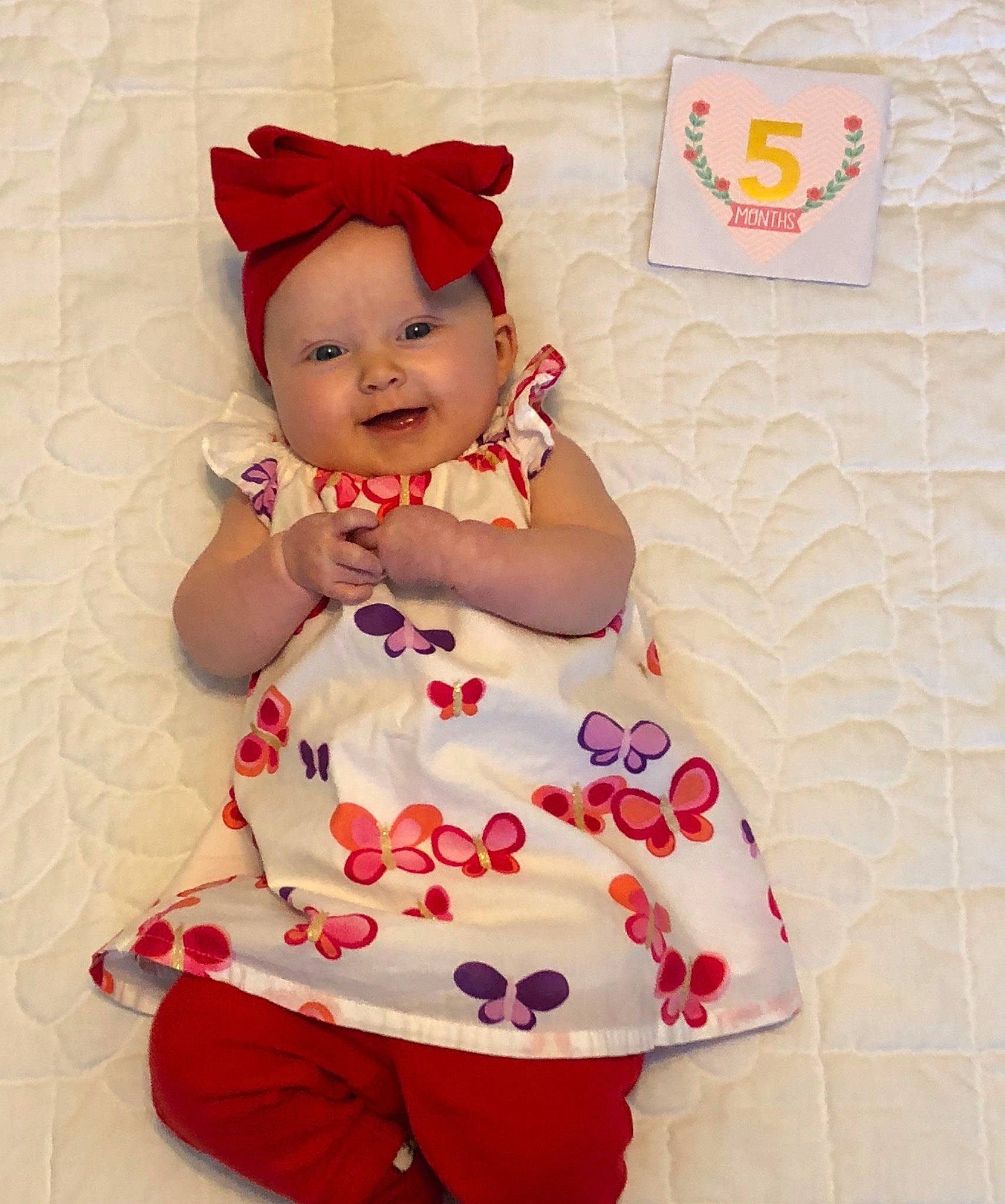 Austyn is registered to the contest to win money with this photo: baby, baby_toddler_clothing, cheek, child, headgear, pattern, person, pink, red, skin, smile, textile, toddler