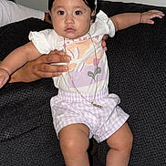 Gianna is registered to the contest to win money with this photo: accessory, baby, bunny_ears, child, colorful_shoes, couch, cute, fashion, hand, indoor, person, pink, portrait, purple, purple_shorts, sitting, toddler, white, white_tshirt, young_child