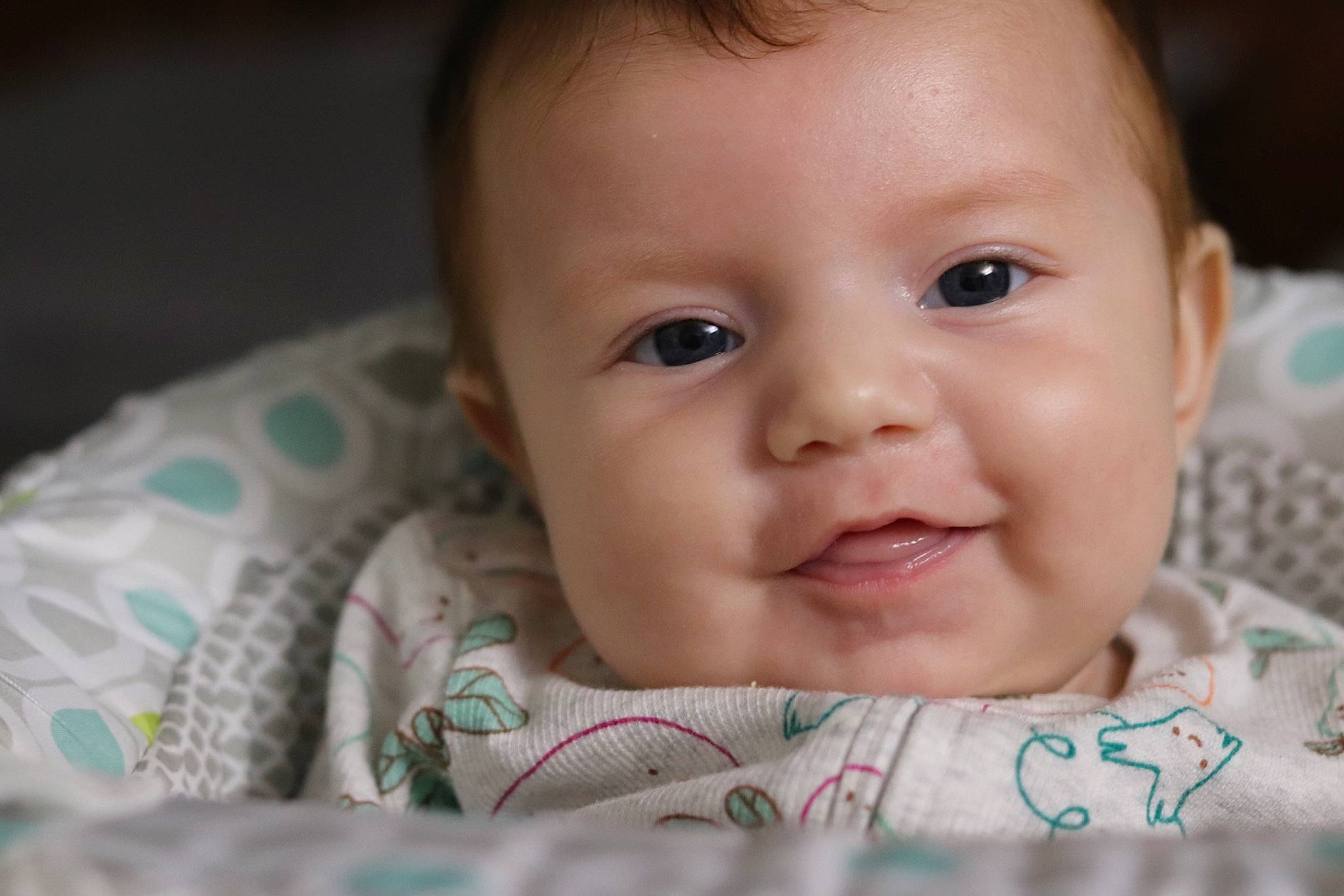 Iris is registered to the contest to win money with this photo: baby, baby_toddler_clothing, cheek, child, ear, eyebrow, eyelash, flash_photography, grass, happy, iris, lip, mouth, nose, pattern, person, sitting, skin, sleeve, smile