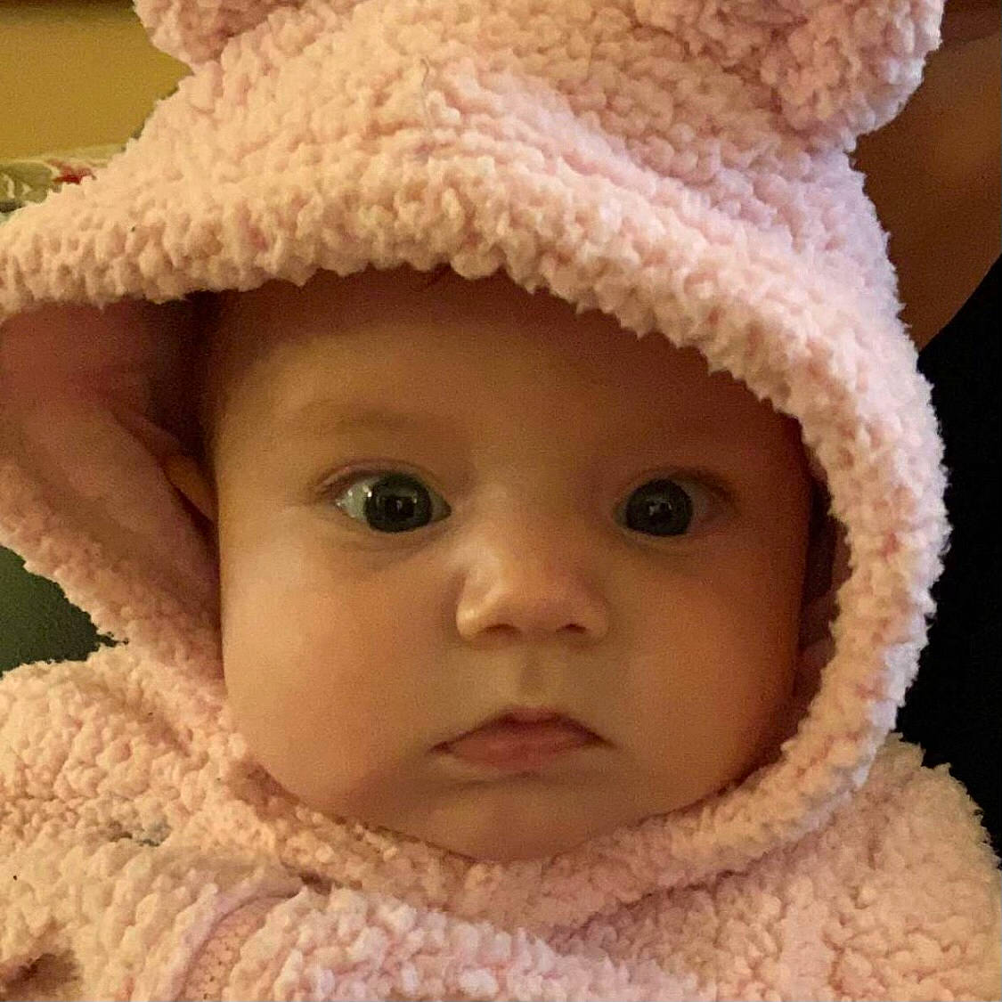 Iris is registered to the contest to win money with this photo: baby, beige, cap, cheek, eye, eyelash, fur_clothing, hat, headgear, headwear, knit_cap, lip, nose, organ, outerwear, person, photograph, skin, sun_hat, toddler