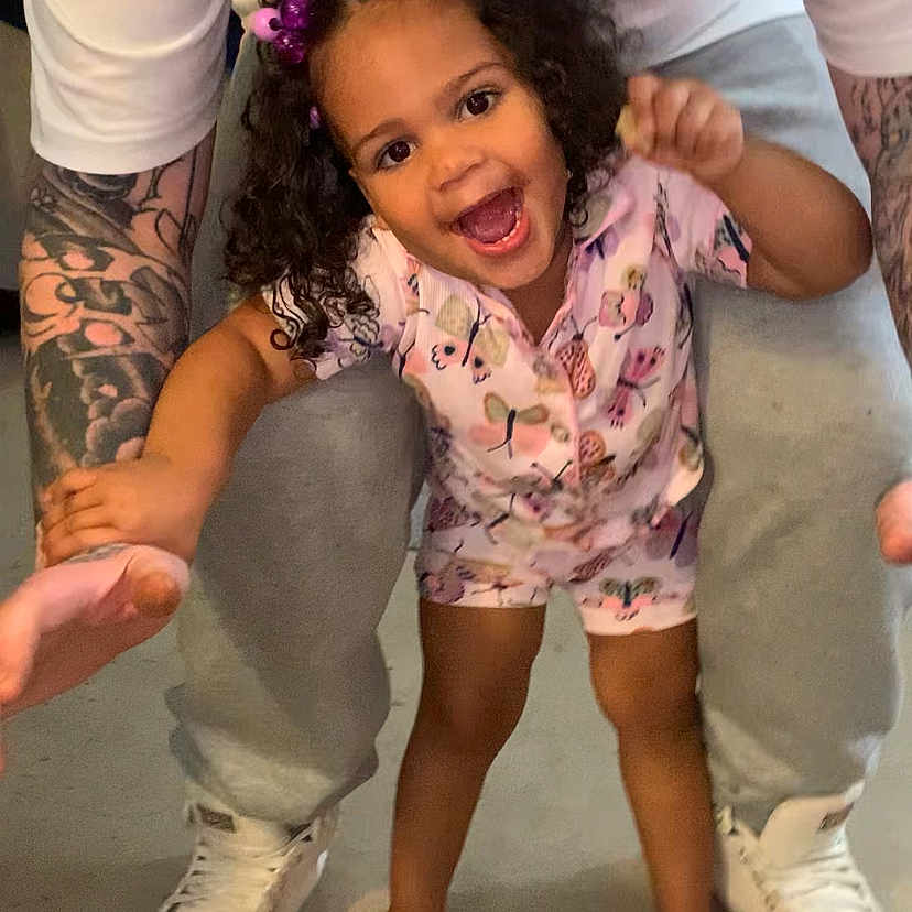 Ahlayla is registered to the contest to win money with this photo: accessories, bodypart, child, clothing, face, female, finger, footwear, girl, hand, head, pants, person, photography, portrait, shoe, shorts, skin, sneaker, tattoo