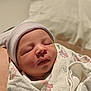 Kairo is registered to the contest to win money with this photo: newborn, baby, sleeping, blanket, hat, infant, wrapped, cozy, hospital, pastel, footprints, face, soft, cute, peaceful, child, portrait, indoor, closeup, person