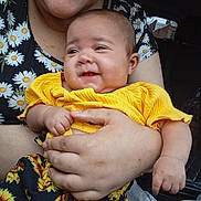 Joel Gonzalez is registered to the contest to win money with this photo: baby, blanket, bodypart, clothing, cushion, dress, face, finger, hand, happy, head, homedecor, laughing, newborn, person, photography, portrait, sitting, smile, t_shirt