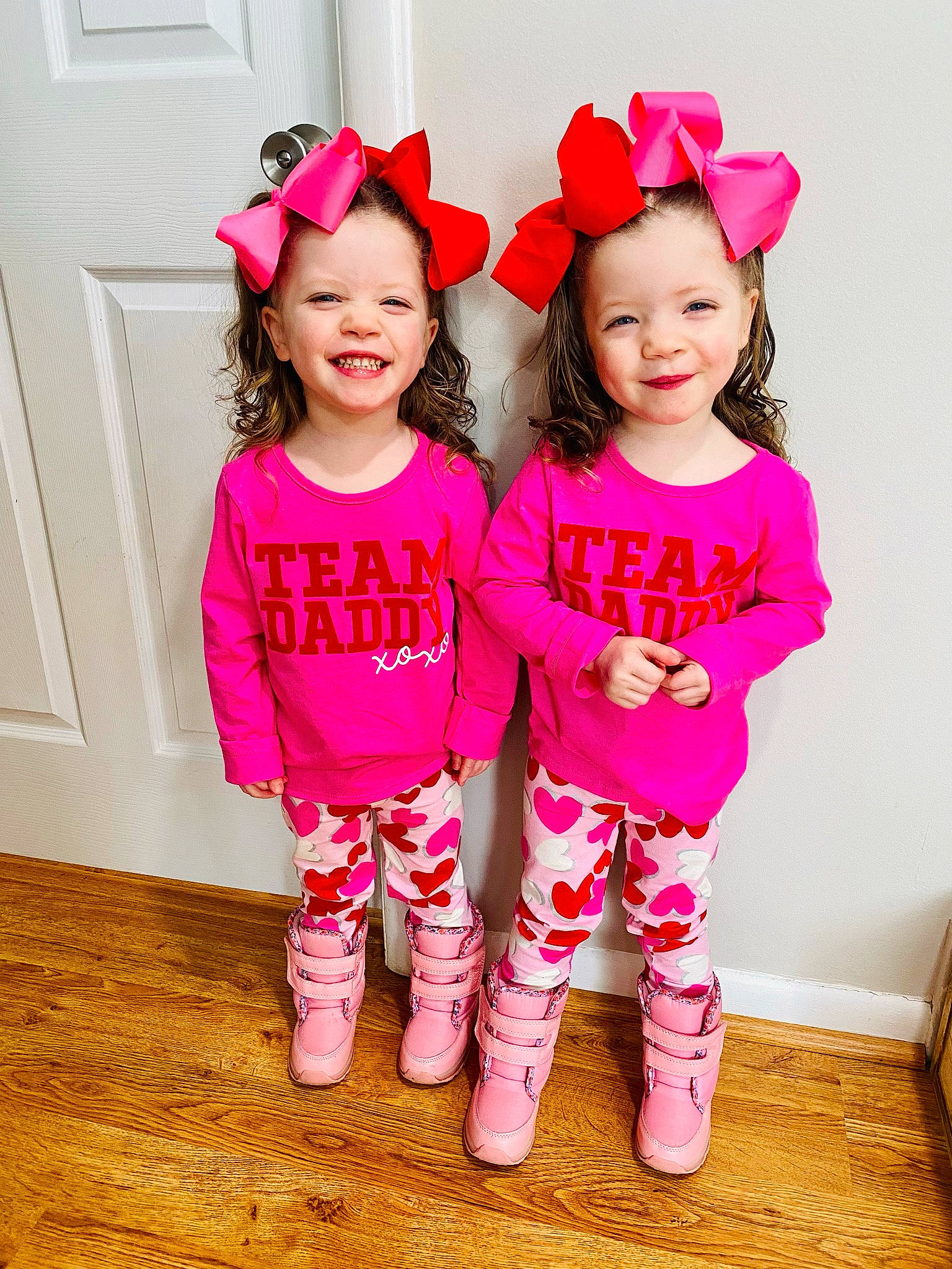 Milena is registered to the contest to win money with this photo: baby_toddler_clothing, child, door, facial_expression, fun, happy, hat, headgear, joy, leg, magenta, person, petal, pink, red, shoe, skin, sleeve, smile, standing