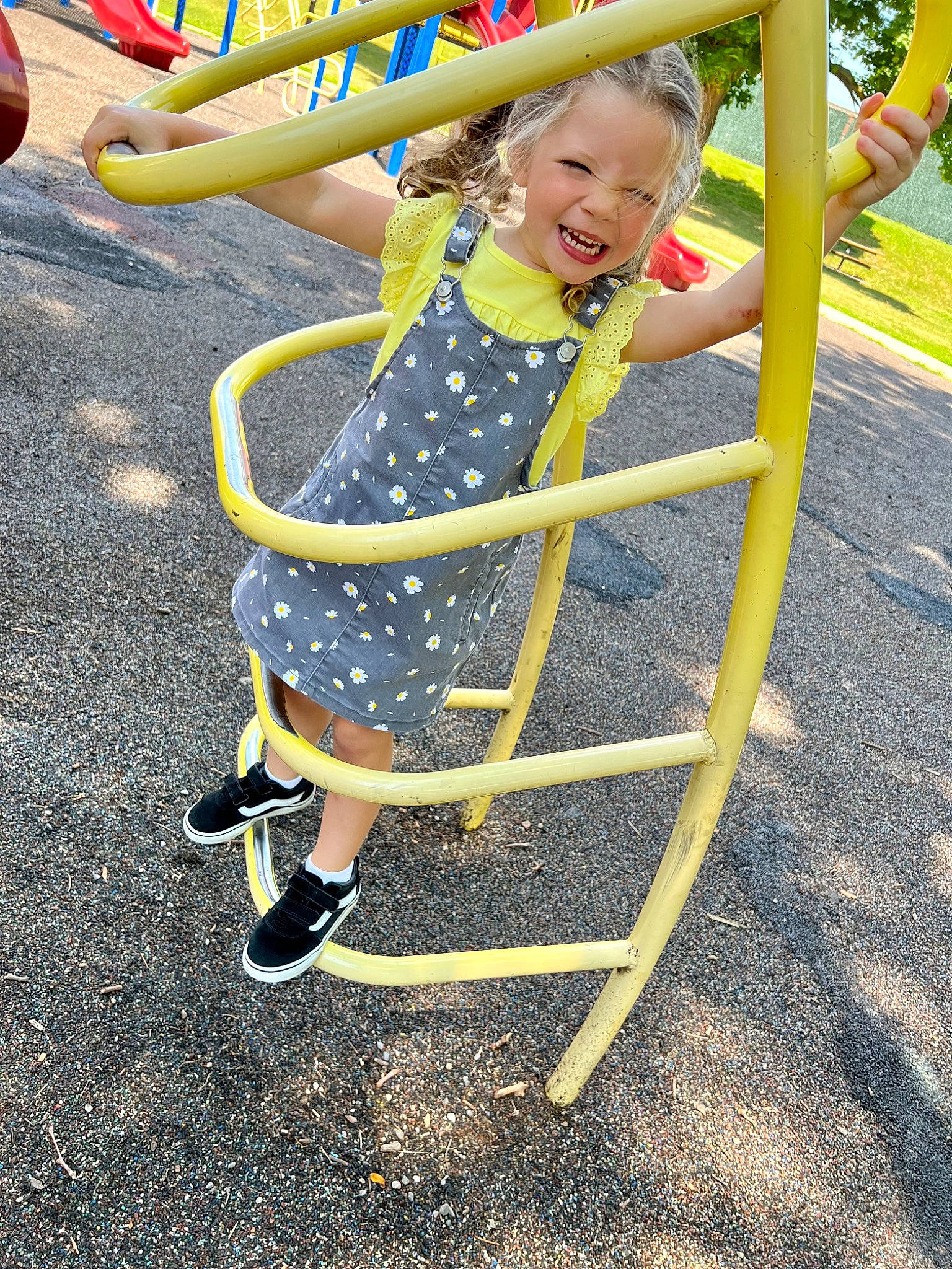 Milani is registered to the contest to win money with this photo: baby_toddler_clothing, child, chute, city, electric_blue, fun, grass, happy, leisure, outdoor_play_equipment, people_in_nature, person, play, playground, recreation, sandal, sitting, smile, toddler, yellow