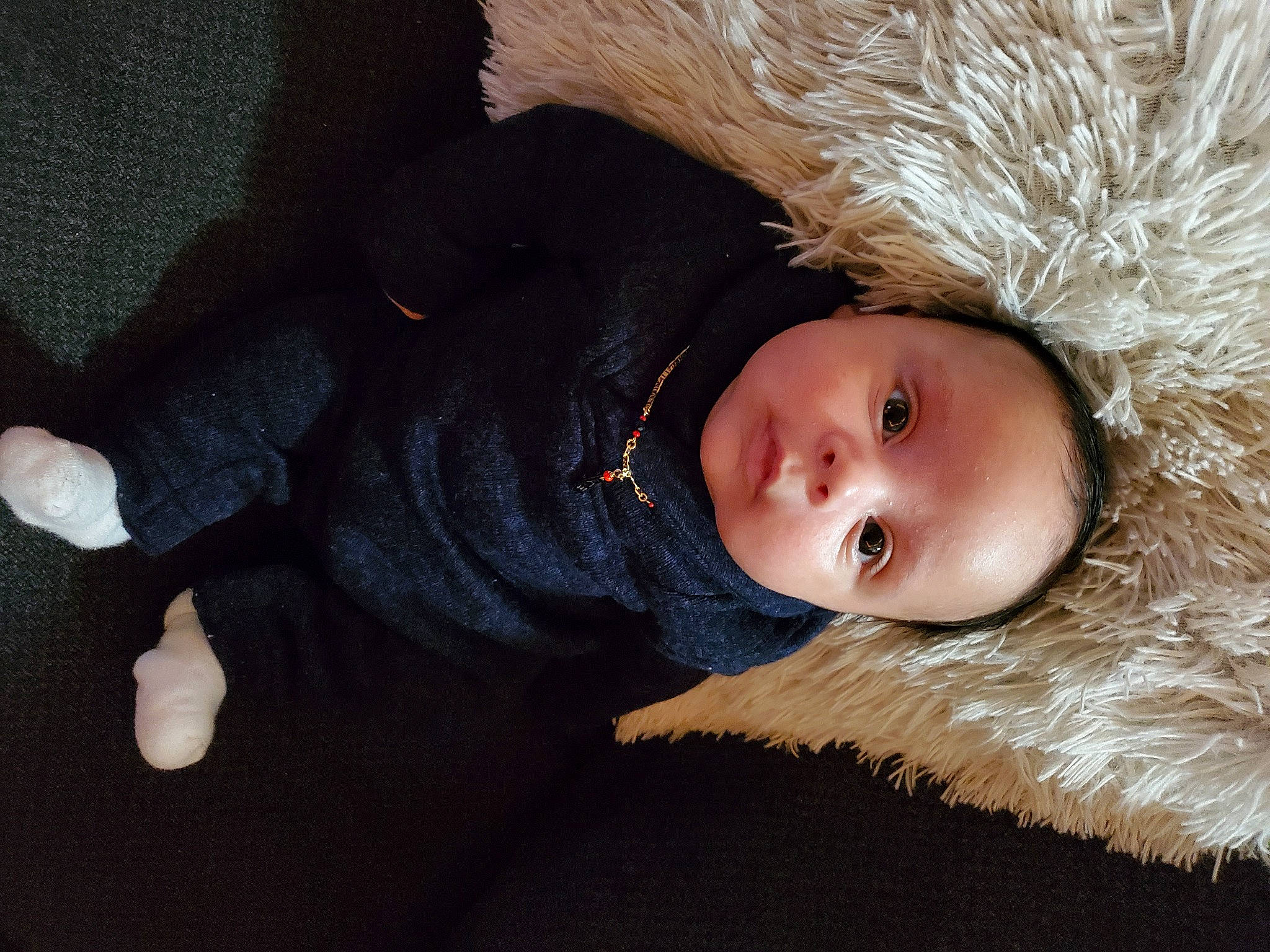 Jamir is registered to the contest to win money with this photo: animal_product, baby, baby_toddler_clothing, beige, cheek, costume_accessory, fur, fur_clothing, natural_material, person, textile