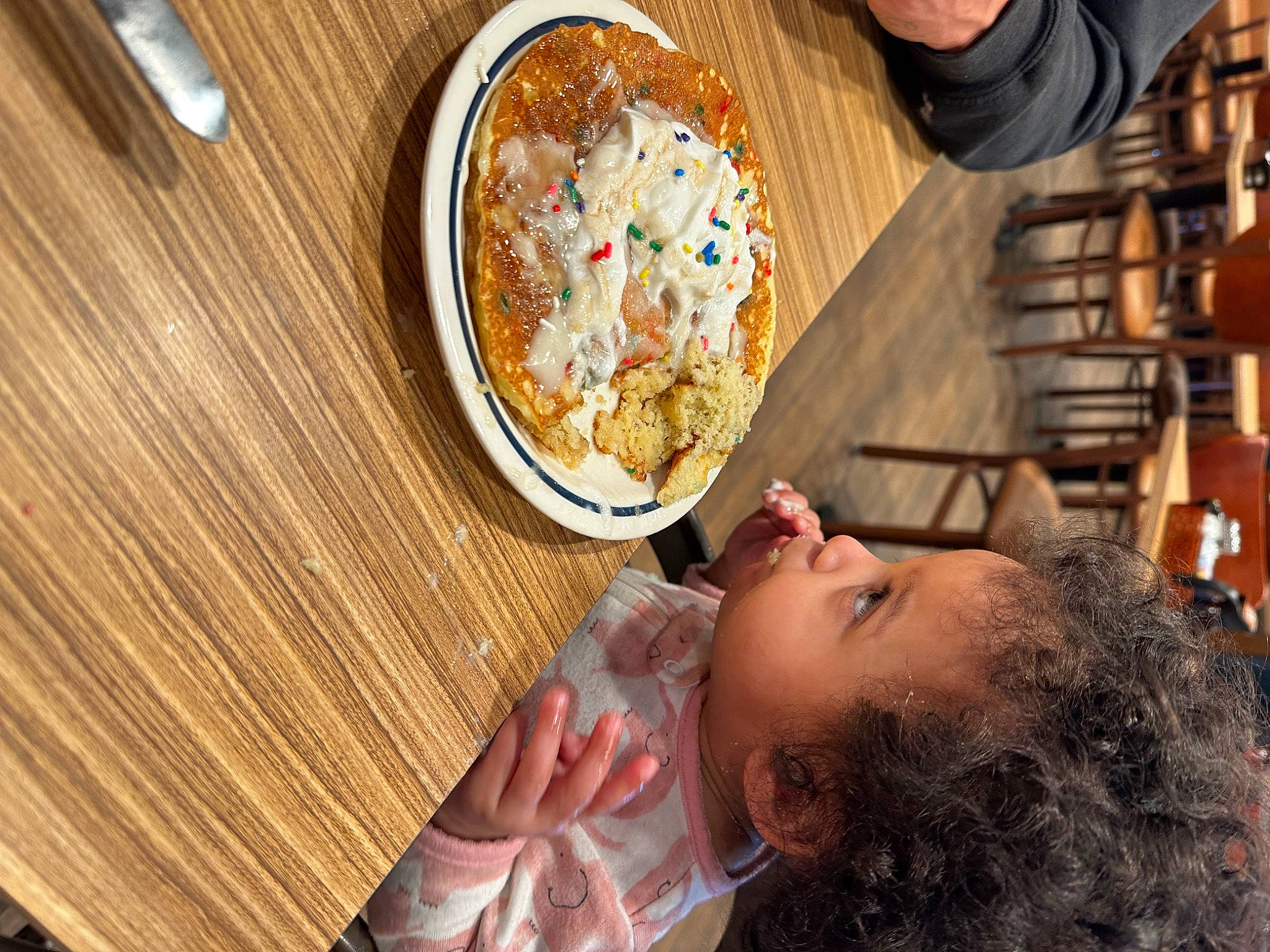 Mya is registered to the contest to win money with this photo: chair, child, comfort_food, cooking, cuisine, dish, flooring, food, hardwood, ingredient, junk_food, leisure, person, pizza, plate, recipe, room, table, tableware, toddler