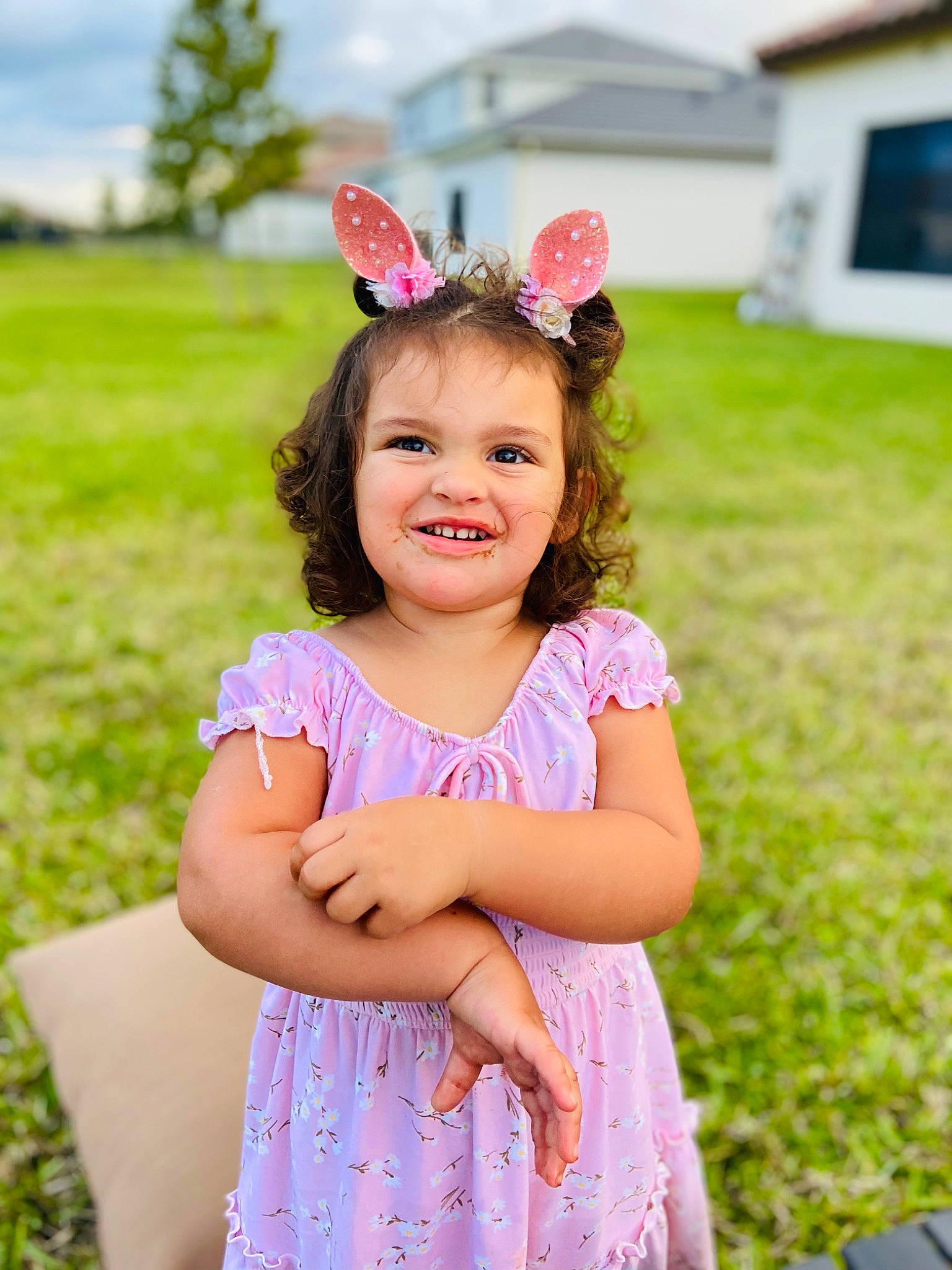 Hannah is registered to the contest to win money with this photo: baby_toddler_clothing, day_dress, dress, flash_photography, grass, green, happy, headpiece, joy, long_hair, magenta, meadow, people_in_nature, person, petal, pink, plant, skin, smile, summer
