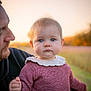 baby, child, person, adult, outdoor, portrait, knitted_sweater, blue_eyes, fall, autumn, nature, field, soft_light, warm_colors, holding, closeup, face, curious, young, casual_clothing