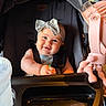 baby, bow, headband, stroller, child, smile, toy, pink, clothing, seatbelt, chicco, infant, happy, portrait, indoor, person, face, cute, baby_bottle, playtime
