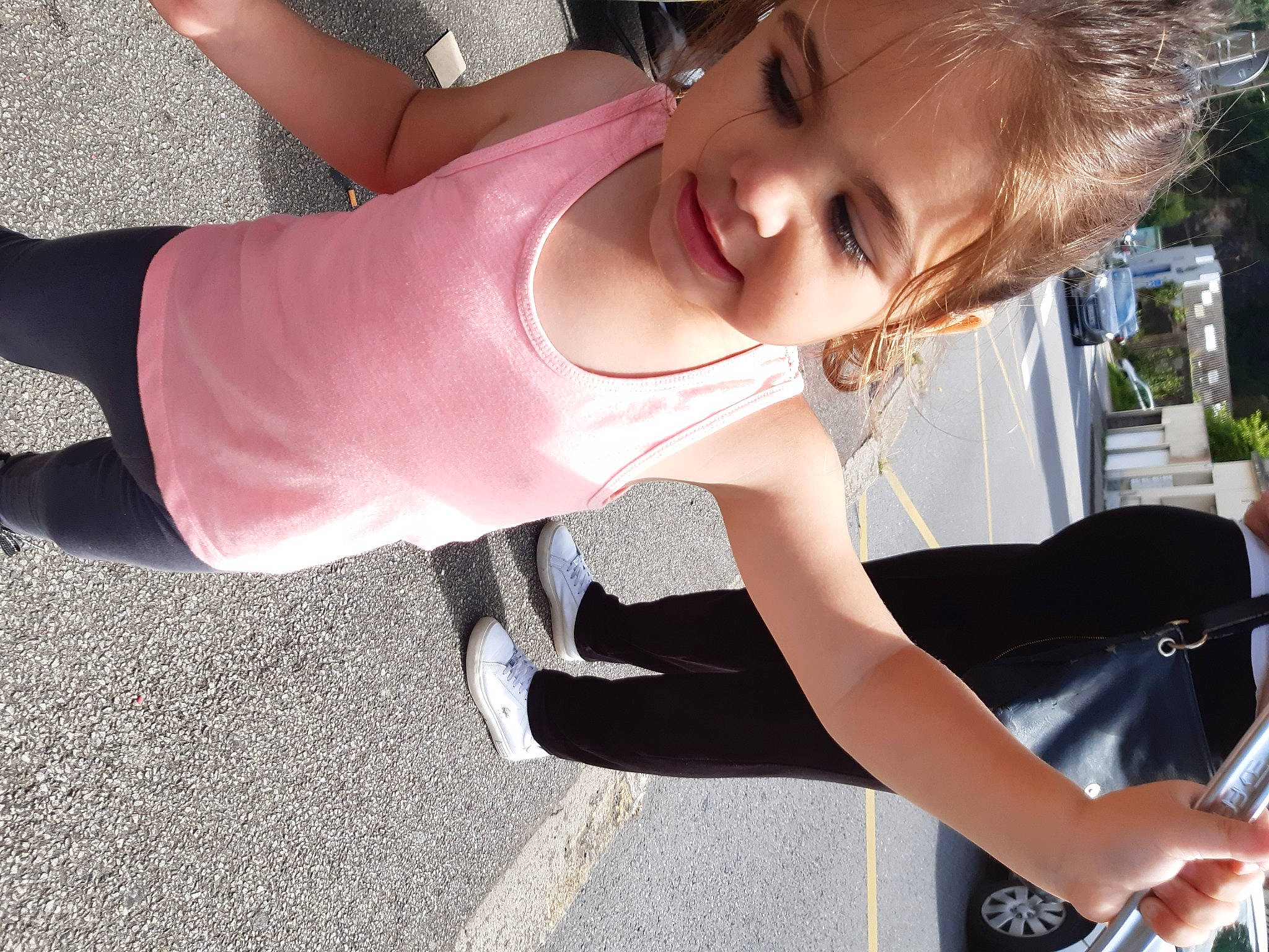 Ashley participe au concours pour gagner de l'argent avec cette photo : automotive_lighting, dress, face, finger, hair, happy, head, knee, leg, light, person, photograph, plant, smile, summer, thigh, tire, toddler, tree, waist