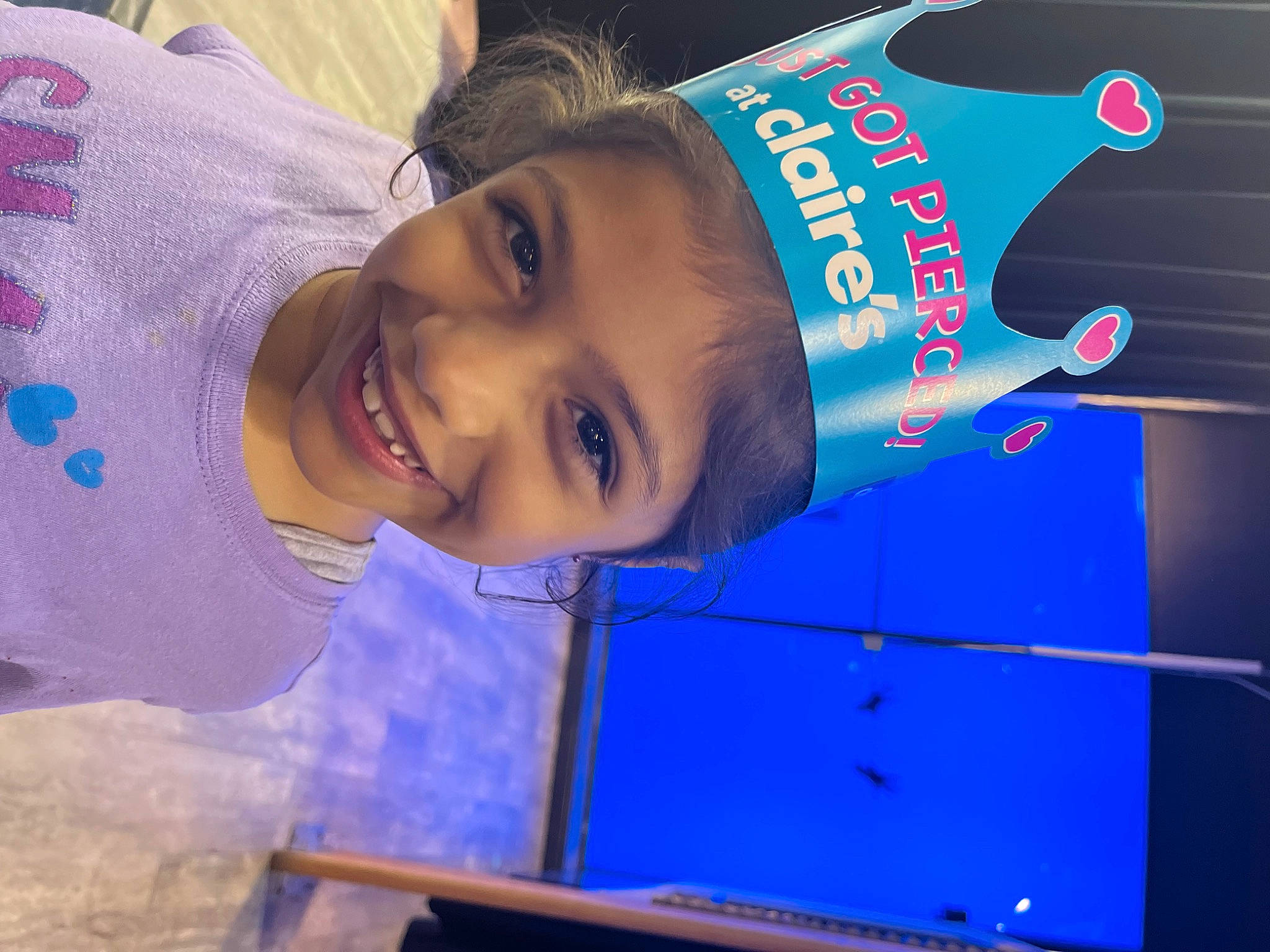 Dallas is registered to the contest to win money with this photo: bottle, child, electric_blue, fun, happy, hat, joy, leisure, logo, magenta, person, recreation, smile, tree, uniform, water, world