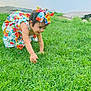 toddler, child, grass, outdoor, dress, bow, water, bridge, nature, playing, greenery, summer, crawling, happy, person, young, sky, rocks, exploration, daytime