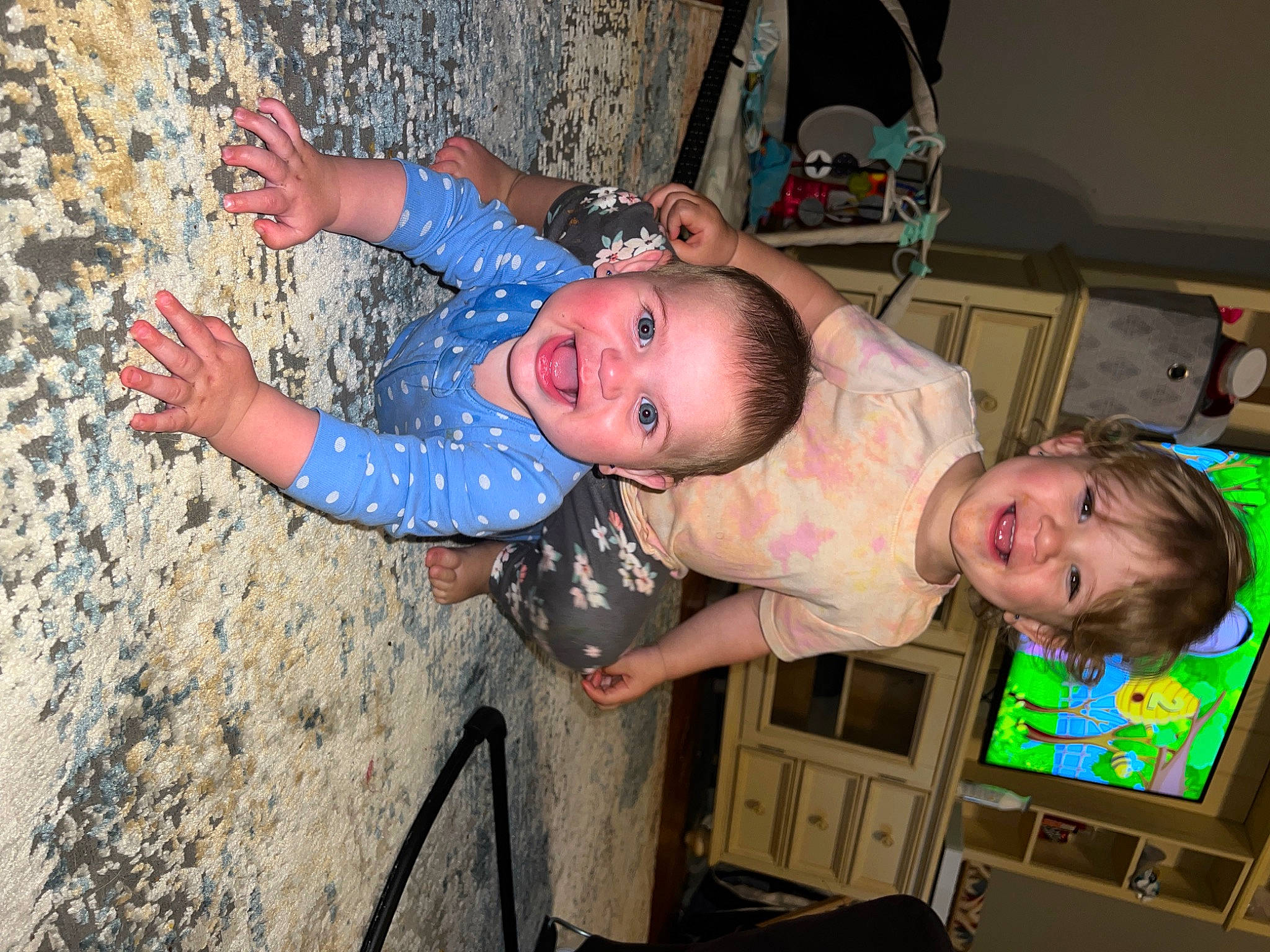 Enola is registered to the contest to win money with this photo: baby, baby_products, baby_toddler_clothing, child, face, facial_expression, fun, happy, hat, head, human_body, joy, mammal, mouth, people, person, skin, smile, sport_climbing, t_shirt