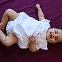 Rita a rejoint le concours — aidez-le/la à gagner de superbes lots ! baby, infant, white_dress, smiling, tongue_out, lying_down, purple_blanket, cute, happy, child, skin, chubby_legs, hand, foot, indoors, portrait, person, one_person, young_child, sleepwear