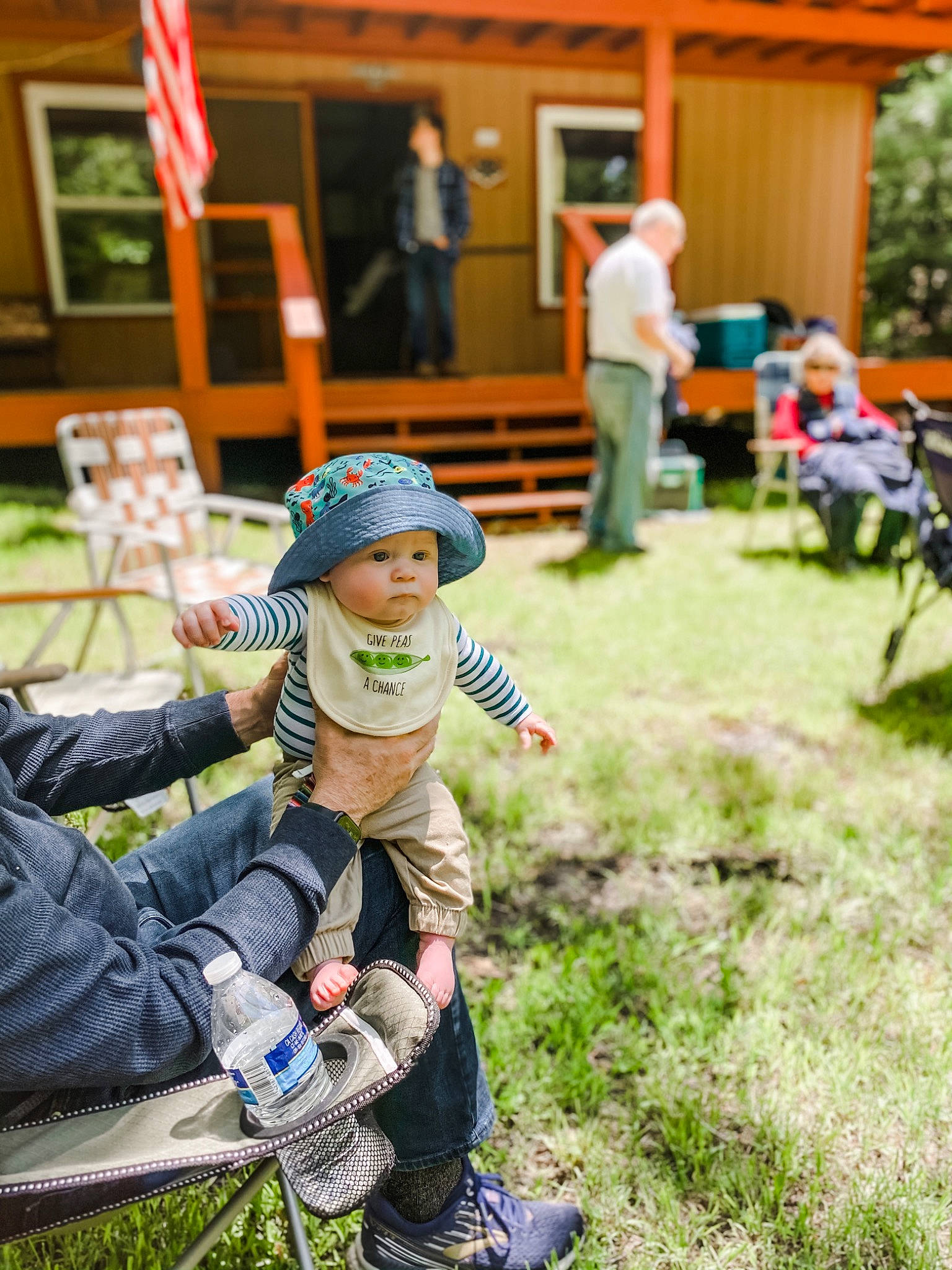 Lee joined the competition — help win amazing prizes! baby, chair, child, clothing, event, flag, footwear, garden, grass, hat, headwear, jeans, lawn, leisure, person, plant, recreation, shoe, sitting, sneakers
