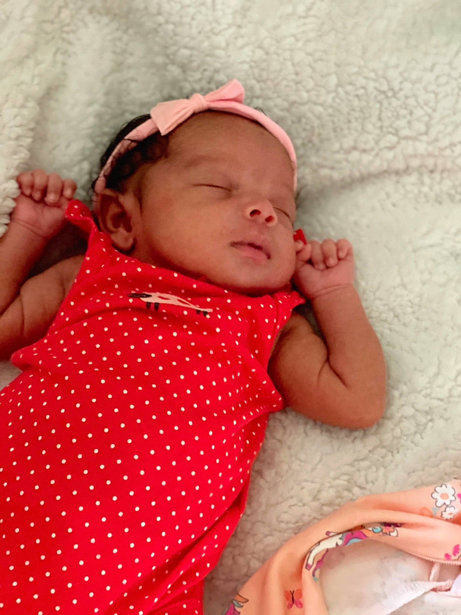 Amoura is registered to the contest to win money with this photo: baby, baby_toddler_clothing, beauty, child, comfort, dress, facial_expression, finger, human, lip, mouth, organ, people, person, pink, product, red, skin, sleeve, textile