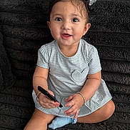 Kiara joined the competition — help win amazing prizes! toddler, child, baby, smiling, pigtails, striped_dress, blue_socks, bracelet, marker, sitting, black_blanket, indoors, cute, happy, portrait, person, young_child, playful, hair_bows, fun