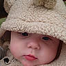 baby, child, face, hood, fuzzy_clothing, cute, indoor, portrait, soft_texture, warm, infant, apparel, headwear, expression, closeup, person, cozy, adorable, young, sleepwear