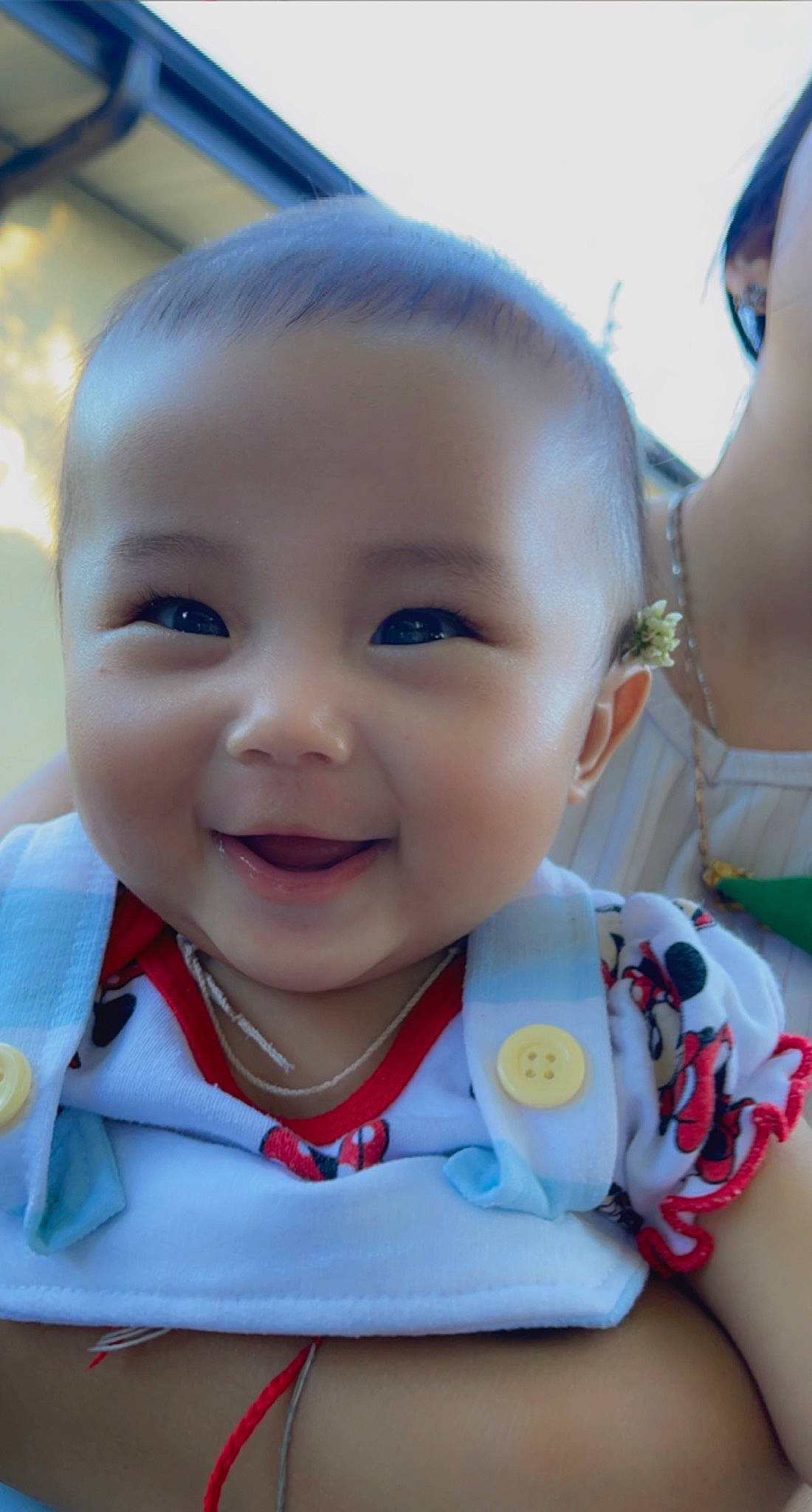 Aurora joined the competition — help win amazing prizes! baby, baby_products, baby_toddler_clothing, bib, cheek, child, fun, grass, happy, iris, joy, laugh, lip, nose, person, sitting, skin, sleeve, smile, toddler