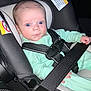baby, car_seat, seatbelt, infant, child, blue_eyes, clothing, safety, warning_label, straps, seat, person, interior, car, young, cute, portrait, looking, secure, hands