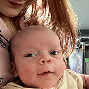 Cashton is registered to the contest to win money with this photo: adult, baby, candid, child, closeup, cute, expression, face, family, hair, holding, human, indoors, infant, light, person, portrait, skin, smile, warm