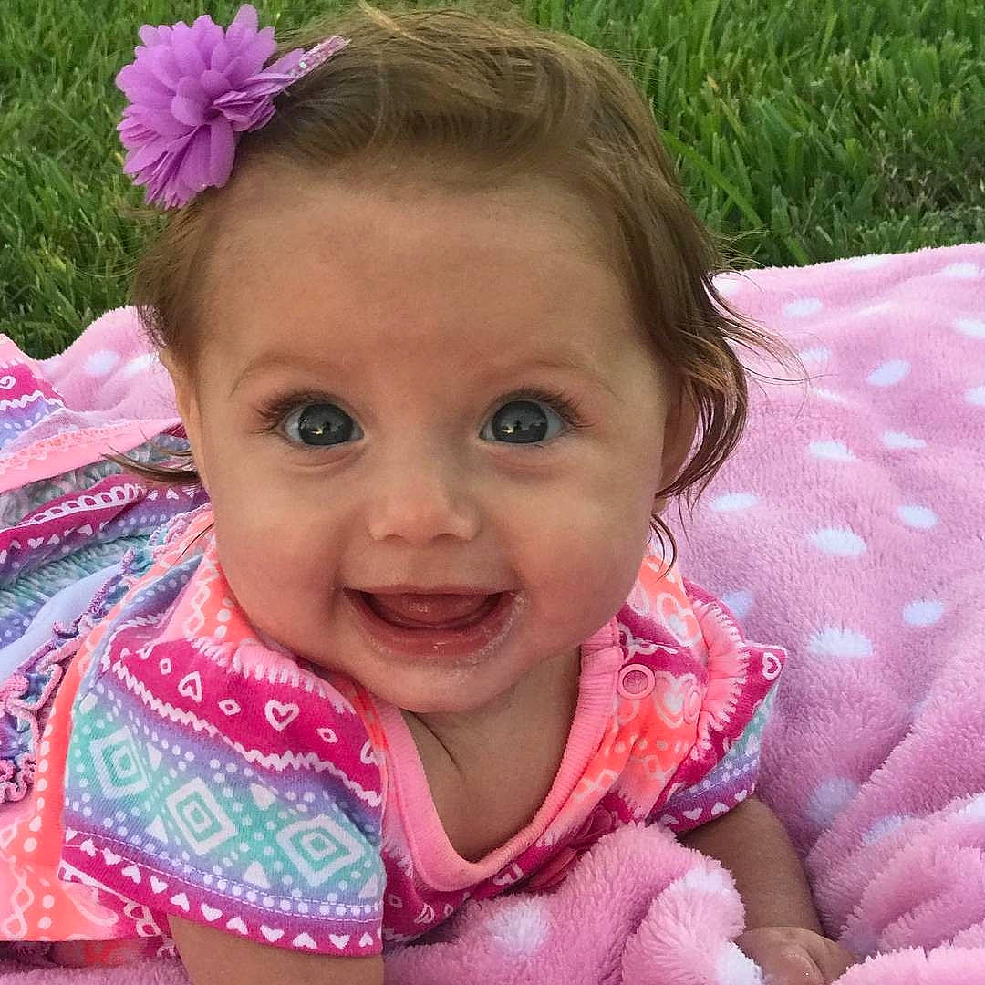 Kayleigh is registered to the contest to win money with this photo: cheek, child, child_model, eye, face, facial_expression, girl, hair_accessory, happiness, head, infant, iris, joy, laughter, lip, mouth, nose, person, pink, skin