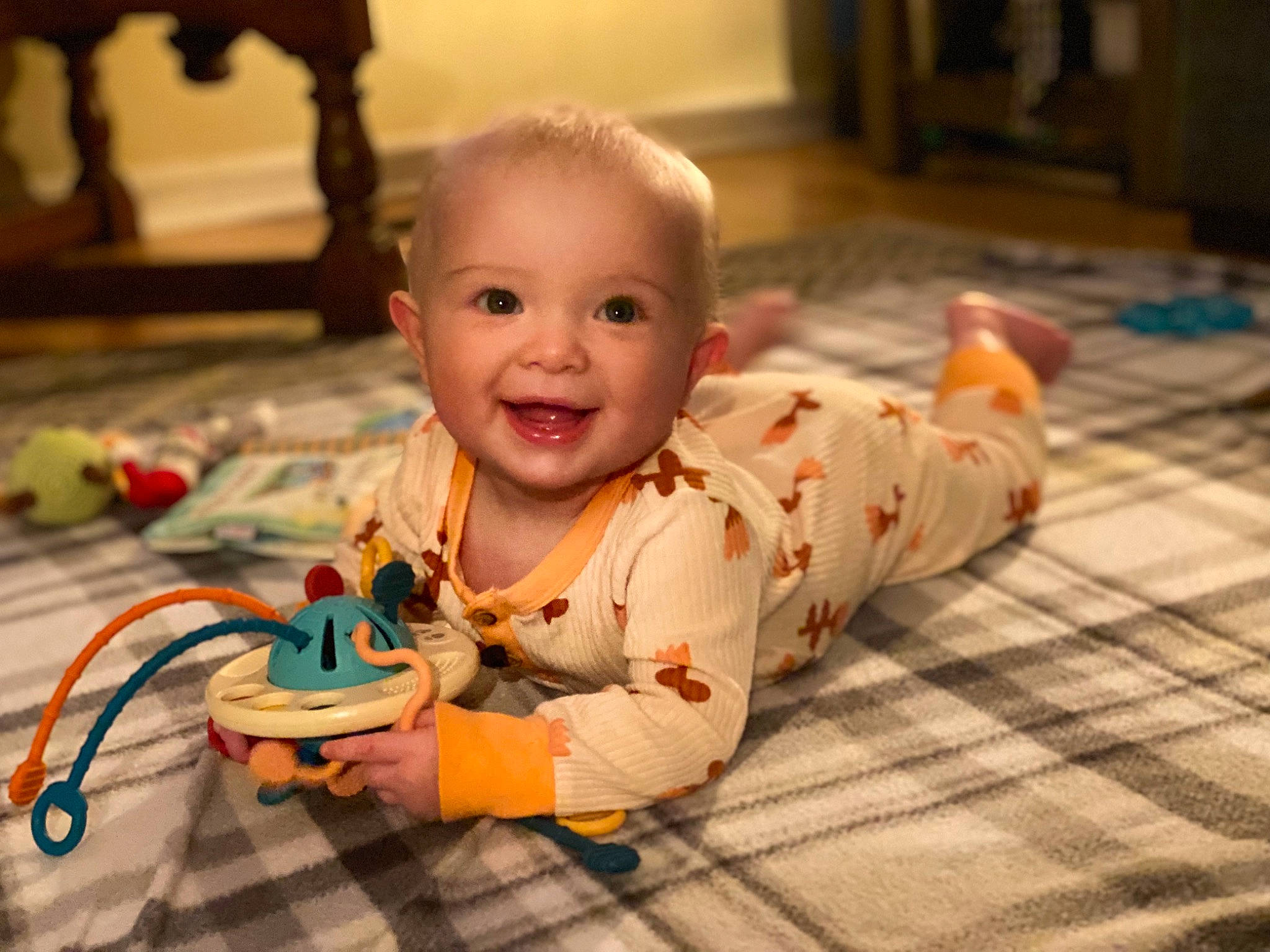 Lily joined the competition — help win amazing prizes! baby, baby_toddler_clothing, cheek, child, chin, eye, facial_expression, flooring, fun, happy, head, iris, joy, mouth, nose, person, sitting, skin, smile, toddler