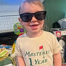 toddler, child, sunglasses, smile, tshirt, indoor, toy, playroom, happy, face, person, clothing, home, young_child, cute, casual, portrait, short_hair, fun, baby