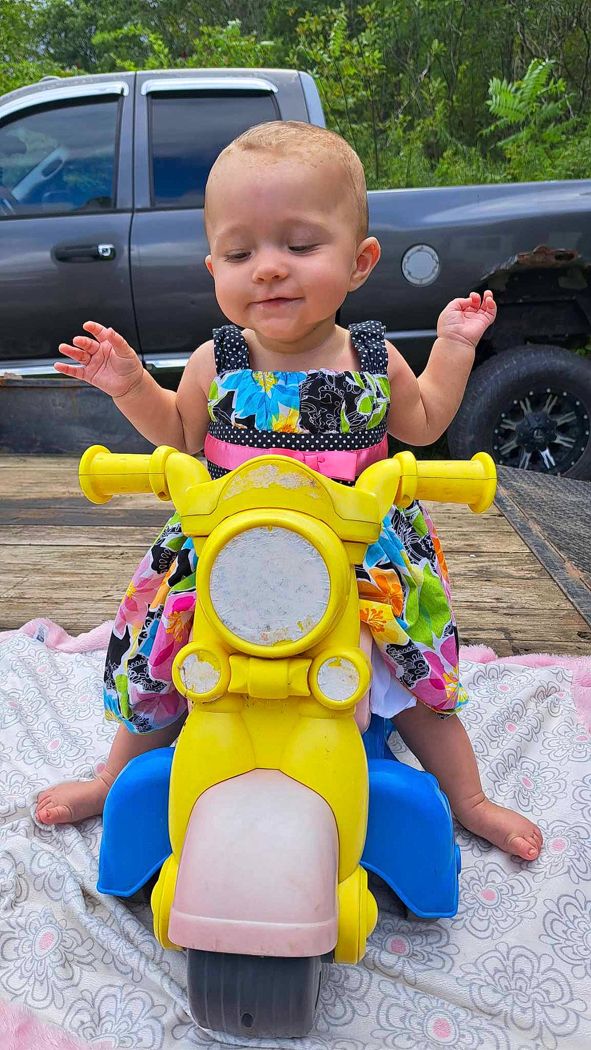 Zoey joined the competition — help win amazing prizes! baby_toddler_clothing, car, child, face, fun, happy, head, leisure, motor_vehicle, person, photograph, pink, recreation, riding_toy, skin, smile, summer, tire, toddler, vehicle