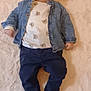 baby, infant, denim_jacket, bear_pattern, white_rug, blue_pants, socks, floor, smile, lying_down, child, cute, casual_clothing, indoor, portrait, young_child, happy, person, soft_texture, comfortable