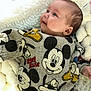 Kayden participe au concours pour gagner de l'argent avec cette photo : baby, infant, mickey_mouse, clothing, sweater, smile, face, head, blanket, soft_texture, comfort, lying_down, child, cute, young, warm, cozy, apparel, person, portrait