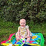 Dawn joined the competition — help win amazing prizes! baby, blanket, blue_eyes, child, colorful, cute, dress, fun, grass, greenery, happy, infant, nature, outdoor, playful, sitting, smile, summer, sunshine, toy
