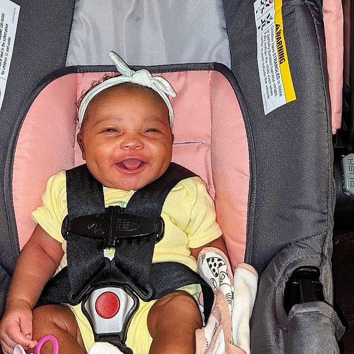 Halo is registered to the contest to win money with this photo: baby, baby_carriage, baby_products, baby_safety, baby_toddler_clothing, cheek, child, comfort, facial_expression, fun, happy, human_body, lap, people, person, product, sitting, smile, thigh, toddler