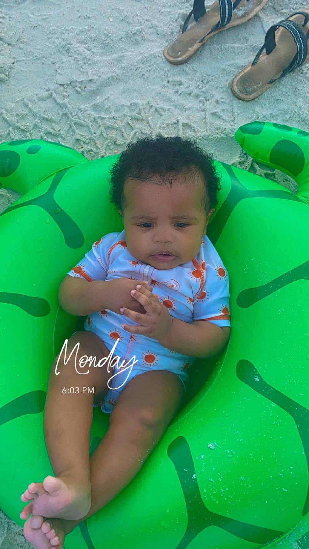 Koda is registered to the contest to win money with this photo: aqua, baby, baby_toddler_clothing, blue, child, eye, footwear, fun, grass, green, happy, head, leisure, person, product, recreation, skin, summer, thigh, toddler