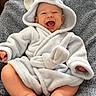 baby, child, smiling, hooded_robe, elephant_costume, blue, blanket, sitting, happy, cute, infant, soft_texture, clothing, indoors, portrait, bare_feet, face, apparel, young_child, cozy