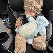 Paxton joined the competition — help win amazing prizes! baby, child, car_seat, fuzzy_clothing, hat, pacifier, plush_toy, sleeping, cute, infant, toddler, car_interior, seatbelt, soft_toy, cozy, resting, adorable, childrens_clothing, transportation, nap