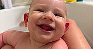 Paxton is registered to the contest to win money with this photo: baby, smiling, wet_hair, bathtub, bath, rubber_duck, skin, water_droplets, happy, child, person, faucet, bathroom, toy, cute, closeup, infant, playful, fun, clean