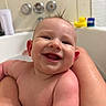 baby, smiling, wet_hair, bathtub, bath, rubber_duck, skin, water_droplets, happy, child, person, faucet, bathroom, toy, cute, closeup, infant, playful, fun, clean