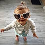 Alycia a rejoint le concours — aidez-le/la à gagner de superbes lots ! baby, blue_dress, child, cute, fashion, floor, heart_shaped_sunglasses, home, indoors, person, pink_socks, playful, ponytail, portrait, smiling, standing, tiled_floor, toddler, white_cardigan, young_child