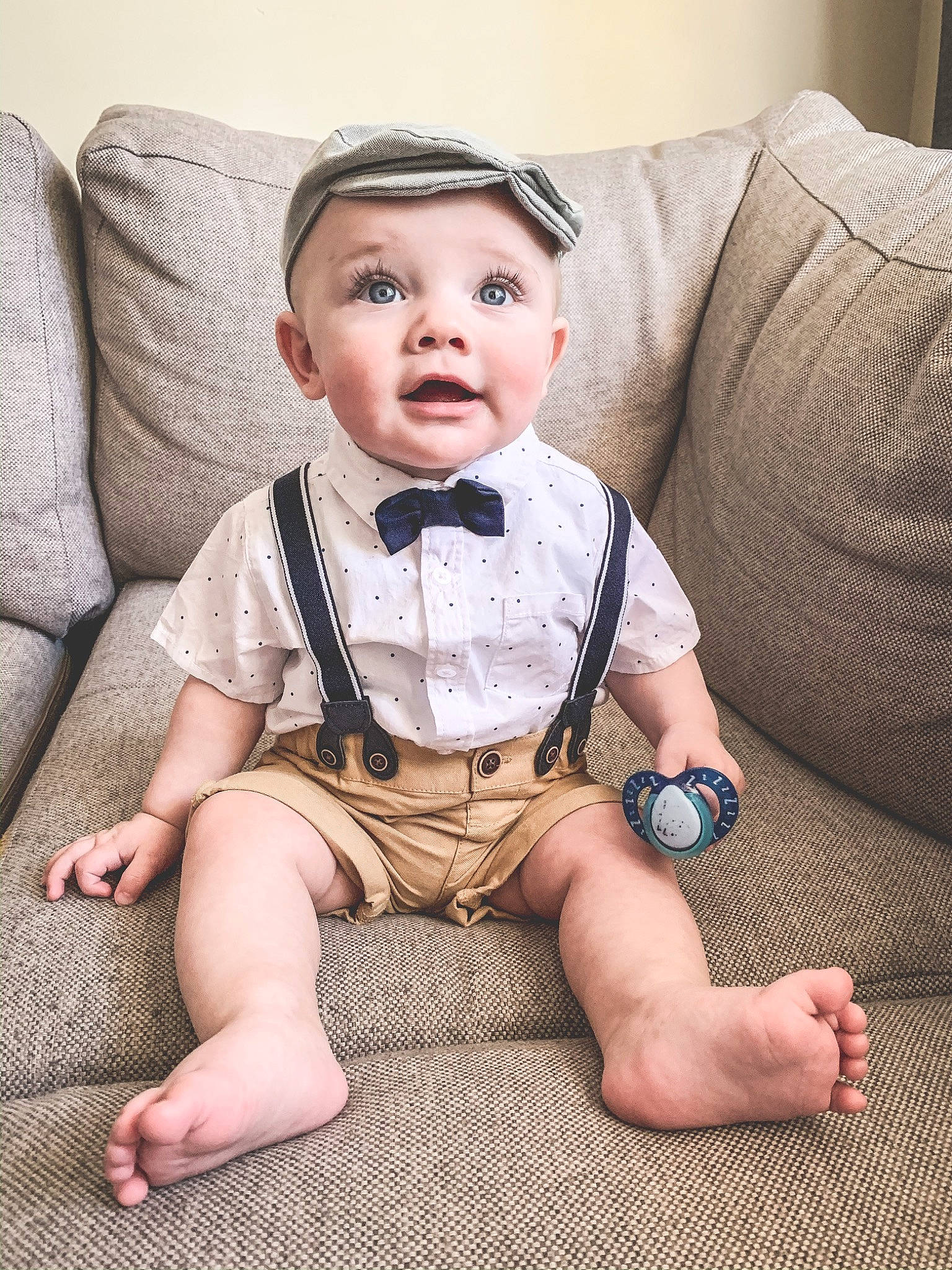 Brock joined the competition — help win amazing prizes! baby, baby_toddler_clothing, bow_tie, cheek, child, face, fashion_accessory, floor, flooring, head, headwear, leg, person, product, sitting, sleeve, suit, thigh, tie, toddler