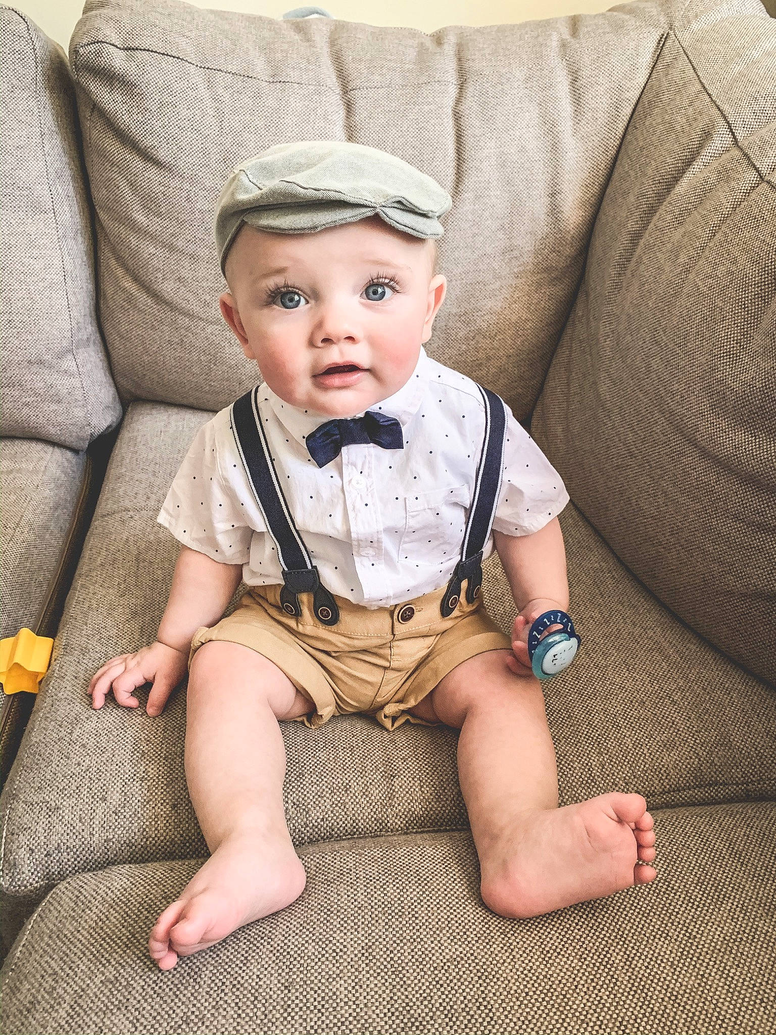 Brock joined the competition — help win amazing prizes! baby, baby_toddler_clothing, beige, child, head, headgear, headwear, leg, person, product, sitting, skin, sleeve, toddler
