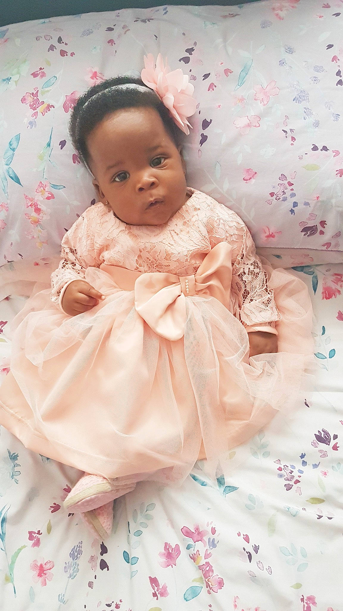 Cherish is registered to the contest to win money with this photo: baby, cheek, child, doll, dress, person, pink, skin, textile, toddler