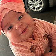 Alona joined the competition — help win amazing prizes! baby, background, car_tire, child, closeup, clothing, cute, face, hand, happy, headband, infant, outdoor, person, pink, portrait, ribbed, skin, smile, young