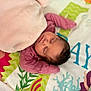 baby, sleeping, blanket, pink, mat, colorful, pattern, aquatic, soft, peaceful, infant, child, resting, cute, portrait, indoors, cozy, clothing, head, face